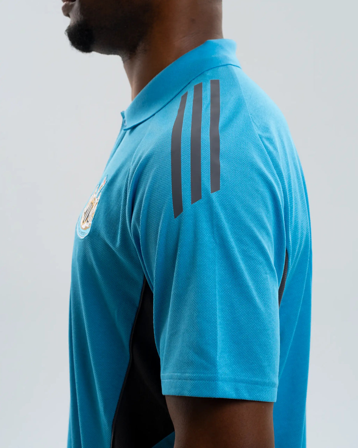 Newcastle United adidas 25/26 Players Range Blue Polo Shirt